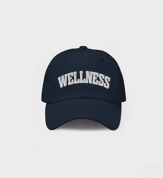 Timeless Always Wellness Club Hat in navy with white "wellness" embroidery and classic dad hat style.